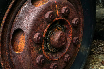 The wheels of an old truck rusted and corroded.                        