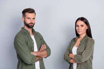 Profile side view portrait of attractive content couple folded arms best team isolated over grey...