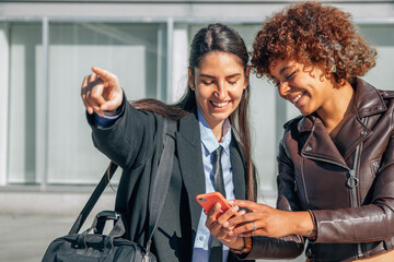 girl showing the address showing the mobile phone