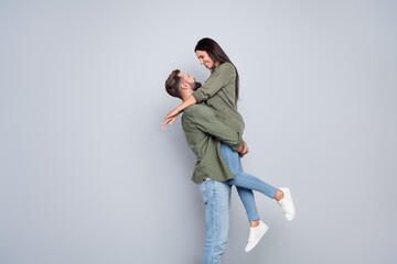 Profile side photo of charming lovely married lady guy cuddle enjoy honeymoon isolated over grey...