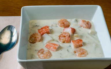 clam chowder  top with shrimp and lobster  meat.