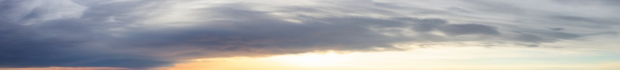 Panoramic View of Cloudscape during a colorful sunset or sunrise