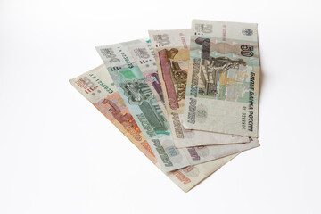 Worn banknotes of fifty, one and five hundred, one and five thousand Russian rubles isolated