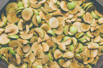 The process of home cooking dried fruits in an electric dryer.
