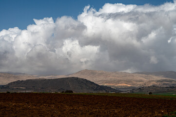 Panoramic view on agricultural valley Zafarraya with fertile soils for growing of vegetables, green...