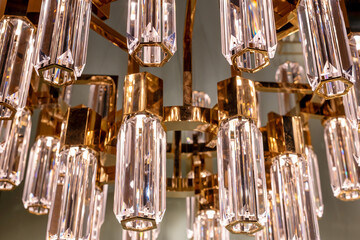 Close up on the glass prisms of a modern chandelier