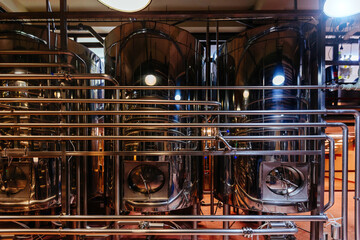 Vats for fermentation. Craft beer production line in modern brewery