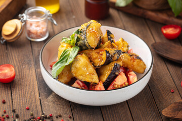 Bowl of sweet chili crispy battered eggplants salad