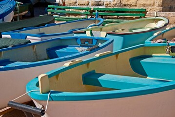 Fototapeta na wymiar Small rowing boats for hire in a harbour on the island Malta.