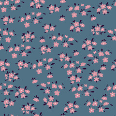 Obraz na płótnie Canvas Seamless pattern with small cute pink flowers on a gray background. Printing color in a flower. Floral seamless background. Elegant template for fashionable prints.