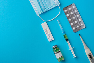 Fototapeta premium Testing for covid-19, vaccination, treatment and protection against coronavirus infection, medical accessories, top view with space for text
