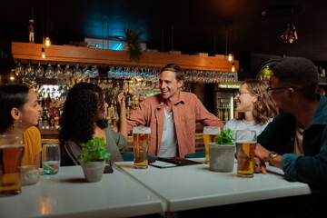 diverse group of friends out for dinner