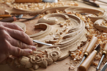 Carpenter wood carving equipment. Woodworking, craftsmanship and handwork concept. Wood processing. Joinery work Wood carving Chisels for carving on the woodworker desk Timber Joinery work.