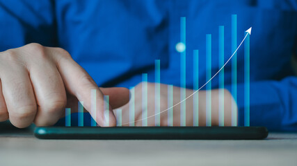 Businessman analysing economic growth graph financial data on laptop. Stock market investment. Financial and banking Technology. Business strategy and digital marketing concept.