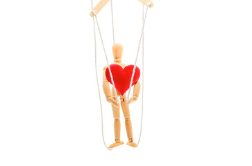 A wooden figure of a man on ropes with a heart in his hands. The social concept