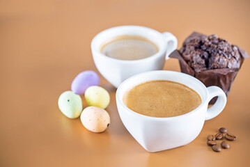 Cup of coffee with pastry for Easter on a white background