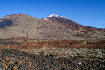 View of Mount Teide with brown red landscape in front