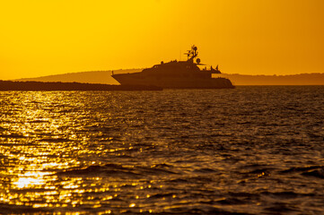 Silhouette of a yacht at sunset
