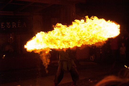 Wall of fire in front of a fire artist at a medieval market