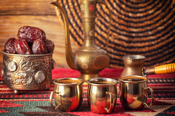 still life with a middle eastern coffee pot, pitcher and fruits