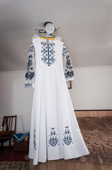 White dress of the bride on a hanger. Wedding