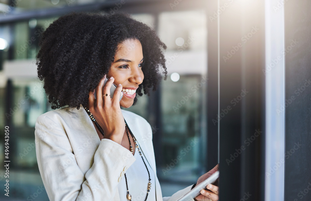 Canvas Prints Everything is ready and waiting for your approval. Shot of a young businesswoman making a phone call in her office.