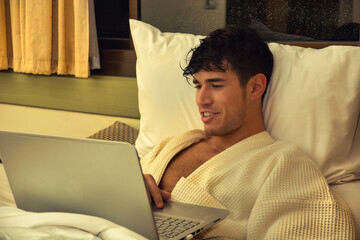 Young Male College or University Student Doing Homework, in Bedroom
