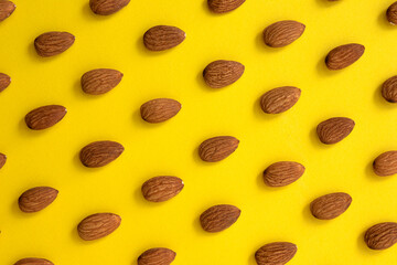 pattern of peeled almond on yellow background