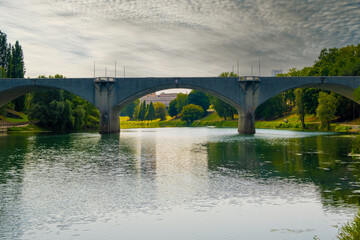 Beautiful sunset view of the arch bridge over the river Po in the city of Turin, Italy.