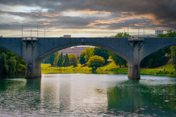 Beautiful sunset view of the arch bridge over the river Po in the city of Turin, Italy.