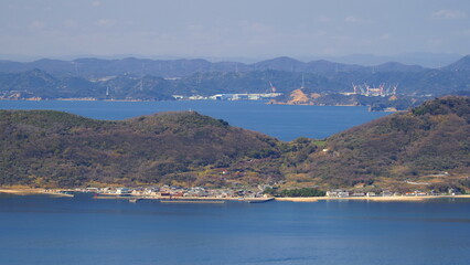 Fototapeta na wymiar 屋島山頂からの女木島と玉野造船所1