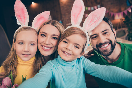 Portrait of full beautiful family make selfie recording video wear rabbit headband house indoors