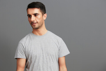 Fototapeta premium man in gray t-shirts posing lifestyle casual wear isolated background