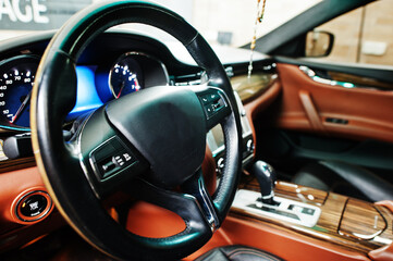 Car steering wheel interior of luxury transport.