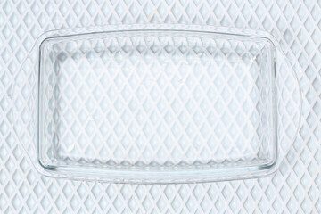 A baking dish cleaned from a thick layer of carbon. Glassware for baking after washing with a steam...