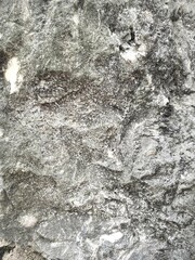 blurred background of granite stone wall, close up stone texture