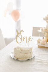 Some bunny is one first birthday cake