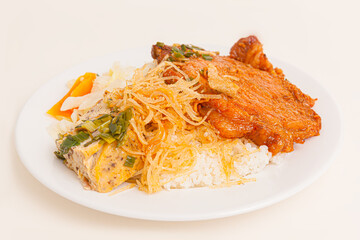 Com Tam. Broken Rice with grilled pork ribs,  egg pie,  Vietnamese food isolated on white background, close-up