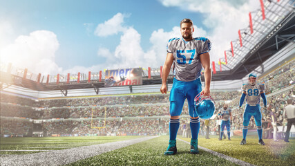 American football. Football player stands in stadium and holds a helmet in his hand. Sport. Stadium...