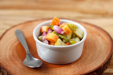 Acar, Indinesian Side Dish for Chicken, Meat, or Martabak Dish. Diced Carrot and Cucumber with Green Chilli and Shallot, Mix with Vinegar, Sugar, Salt.