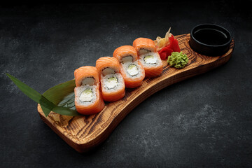 Sushi roll Philadelphia on a wooden board