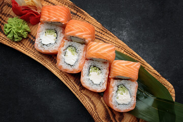 Sushi roll Philadelphia on a wooden board