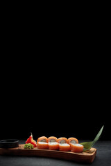 Sushi roll Philadelphia on a wooden board © pobaralia