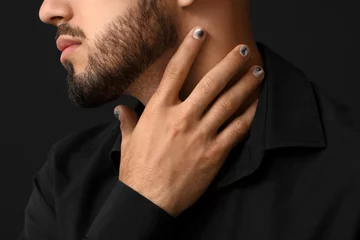Gordijnen Man with stylish manicure touching his neck on black background, closeup © Pixel-Shot