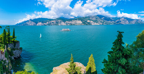 Ferry passing Lago di Garda in Italy - obrazy, fototapety, plakaty