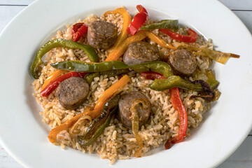 brown rice served  with peppers onions and sausage