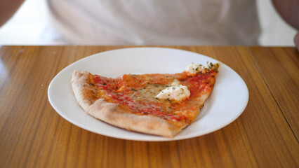 Slice of pizza on a plate