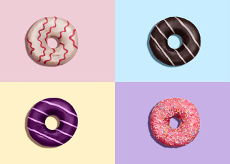 Donuts. Concept photo in top view. Various glazed doughnuts with sprinkles on colorful background