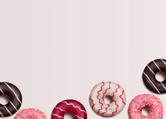 Donuts. Template with copy space. Frosted doughnuts with toppings and sprinkles on white background