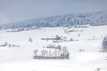 remote farm in the hills of Emmental during winter